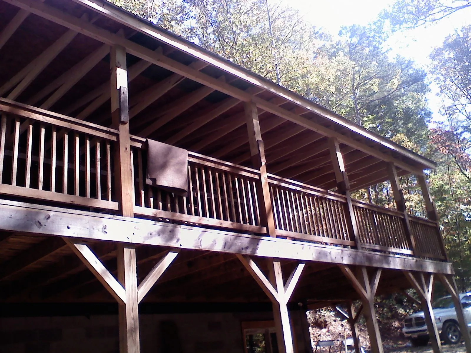 Timber framing under a new elevated porch and deck — Roof Leak Repair in North Brookfield by Roofing Brothers